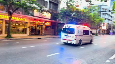 ambulance navigating through busy bangkok traffic