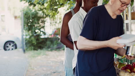 underprivileged people receive free food