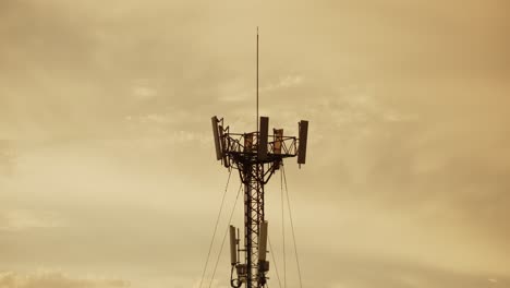 5g communication tower in buenos aires with a moody sunset sky in the background