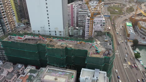 Excavators-And-Crane-In-A-Construction-Site-In-Causeway-Bay,-Hong-Kong