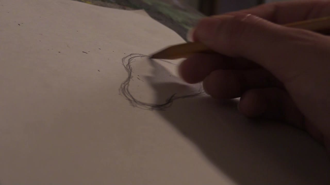Artist Sketching with a Pencil