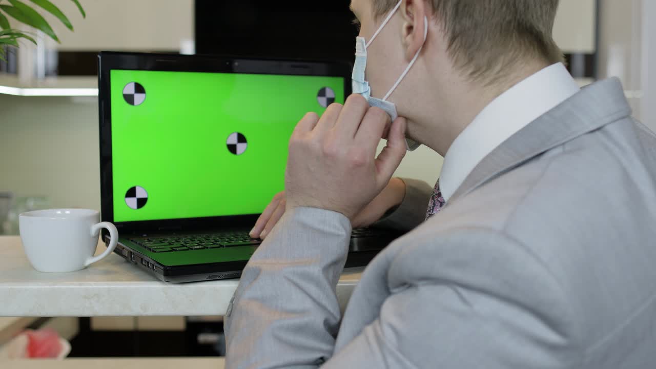 Quarantine. Businessman working on laptop at home office. Coronavirus