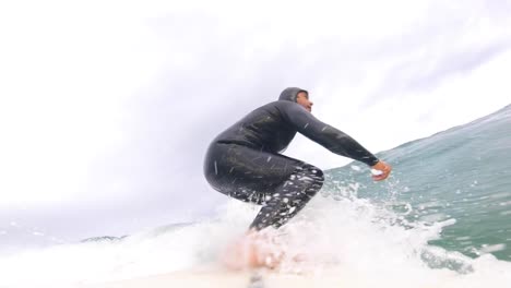 young male surfer rides the ocean wave in europe-1