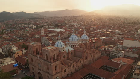 stunning panoramic view of the historic center of cuenca, ecuador, with a focus on the majestic blue domes of the cathedral of the immaculate conception.