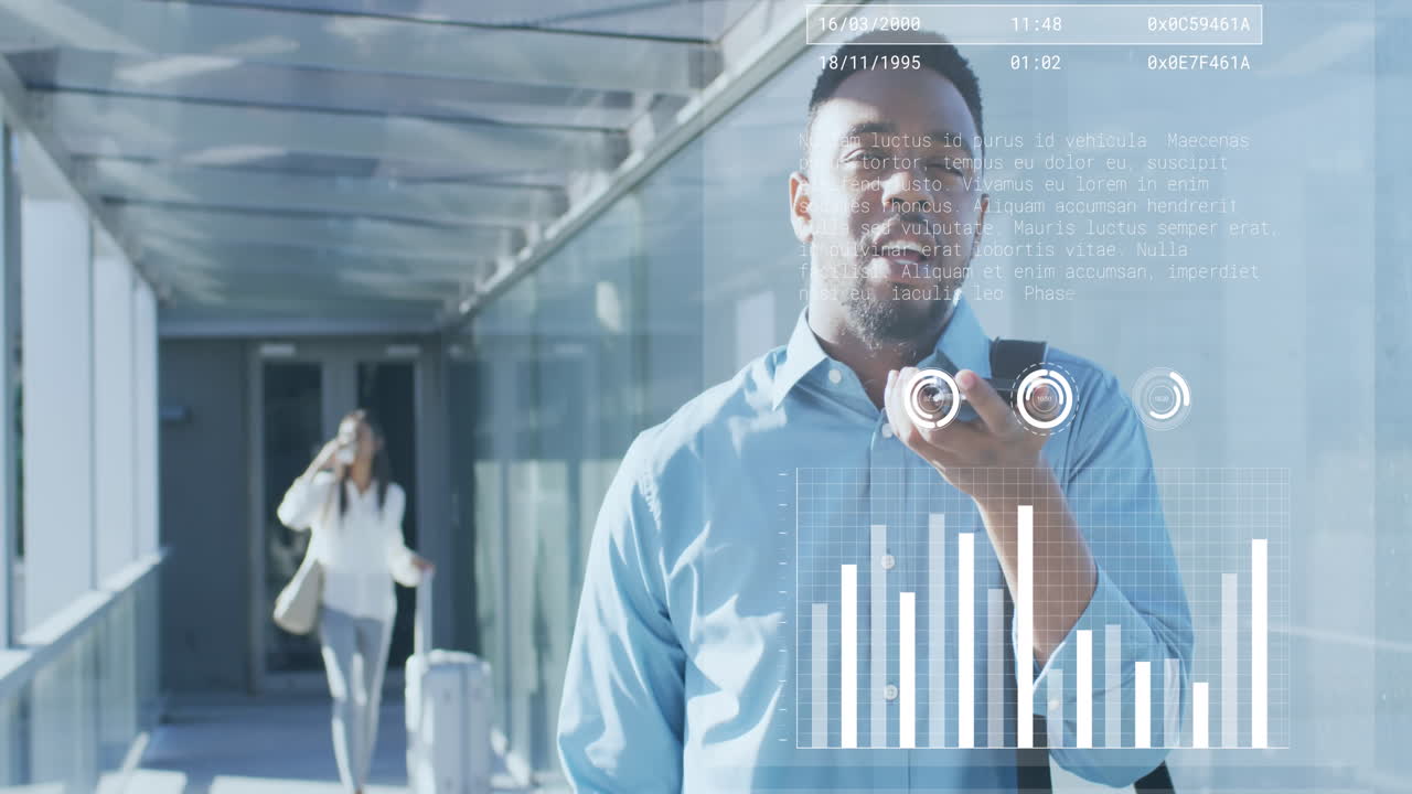 Animation of graphs, african american man talking on cellphone while walking in corridor of office