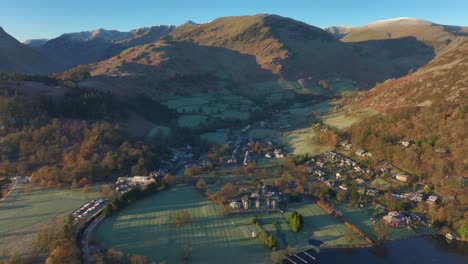 village of glenridding surrounded by mountains at dawn in autumn