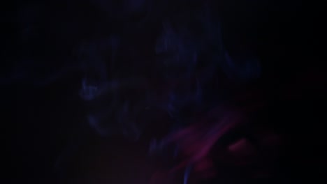 colors smoke in dark background