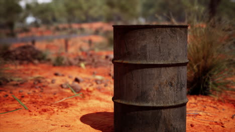 old-empty-rusted-barrel-on-sand