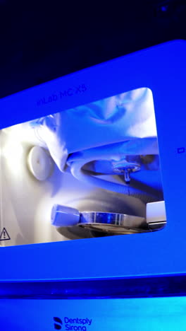 processing of carving out shape. highly productive automated dental milling machine working creating implants