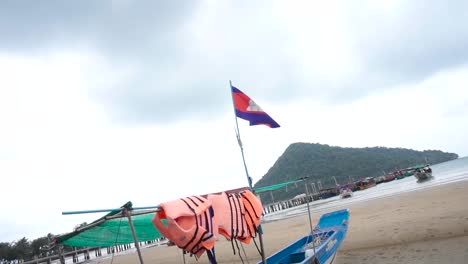 cambodian flag shown in iconic cambodian environment