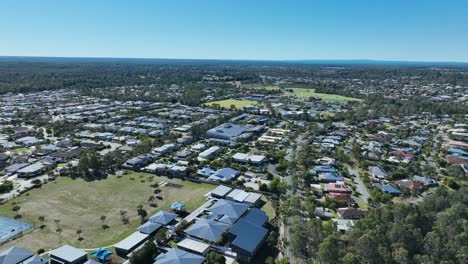 drone push in tracking shot of narangba brisbane queensland suburb