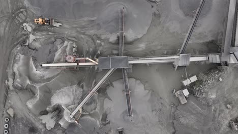 Top-down-aerial-view-of-Limestone-quarry-mining-site-for-company-Visnes-Kalk-AS-between-Molde-and-Kristiansund-in-Norway---Aerial-showing-heavy-machinery-and-equipment-at-job-site