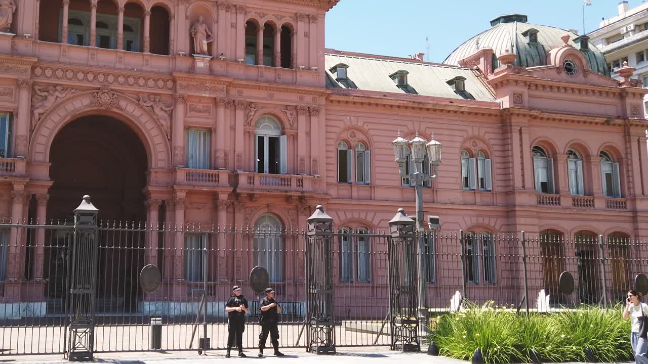 Panoramic view at the Pink House with Police officers and fences, landmark of the Capital City