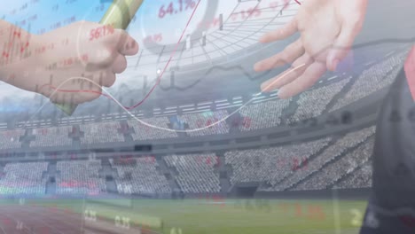 stock market data processing against close up of hand passing a baton against sports field