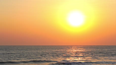 Yellow-Sun-and-Birds-Flying-Above-Tropical-Sea