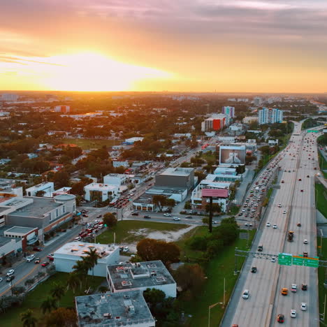 lively traffic on the roads on miami, florida, usa at sunset. vibrant city scenery under the splendid colorful skies at sundown.