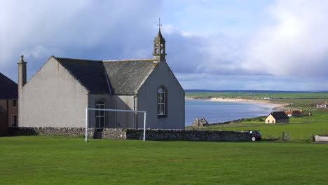 a pretty church along the abandoned coastline of northern scotland