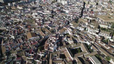 drone flying over roofs of cordoba city in spain. aerial top-down reverse