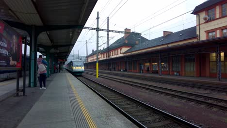 pendolino train arriving at the platform in the town of česká třebov?