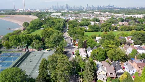 drone circling over tennis courts on the beach of lake ontario near toronto