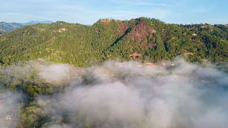 Weather-in-the-Caribbean,-Dominican-Republic,-Jarabacoa,-low-clouds-below-the-mountains-during-the-morning