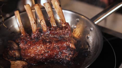 cooking lamb ribs in a pan