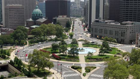 aerial push-in shot above logan circle in philadelphia, ben franklin parkway, city hall