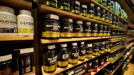 sport nutrition store interior with large choice of nutritional supplements.