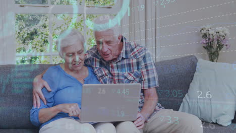 animation of financial data processing over senior caucasian couple using laptop