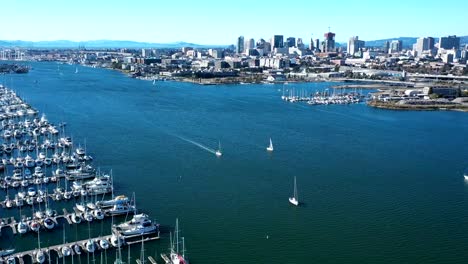 hyper-lapse of a large marina with sailboats and views of the city