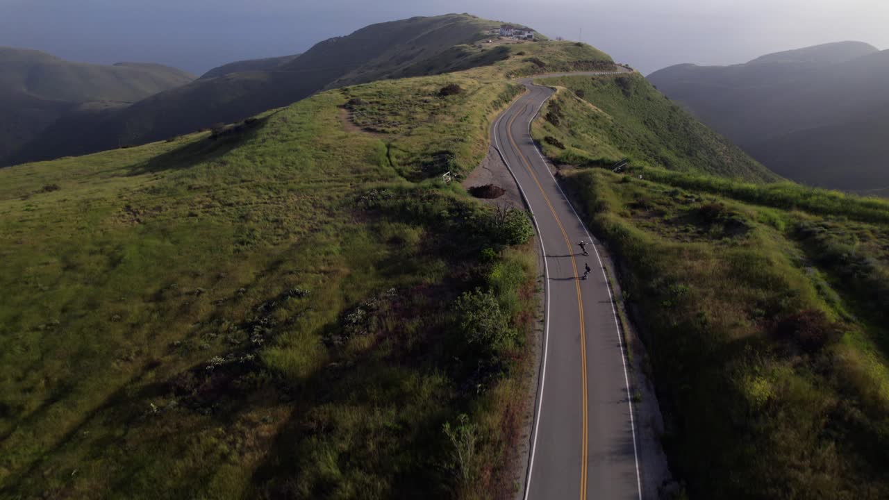 Longboarding down a mountain road at high speed in California