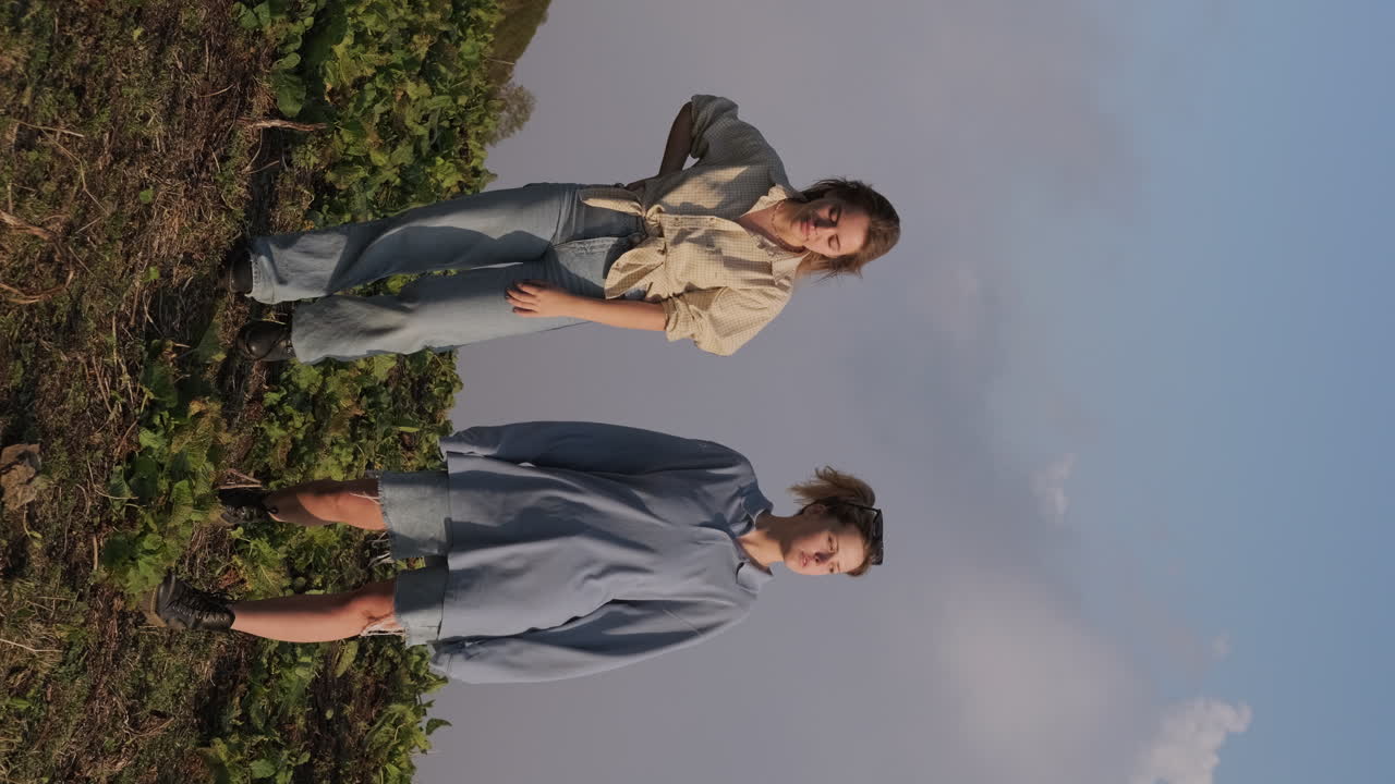 Two girls posing in a vineyard