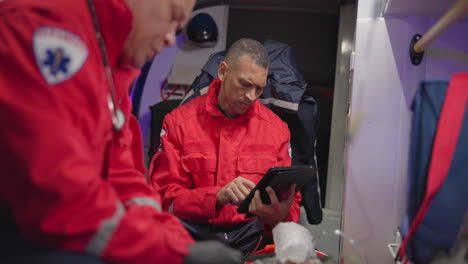 Talking,-man-and-a-tablet-at-sea-for-rescue-team
