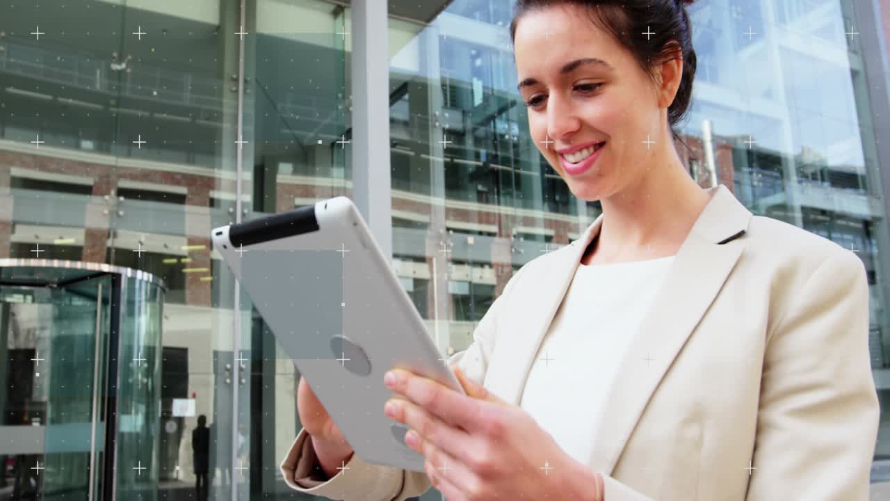 Businesswoman reading notification on tablet and swiping corporate update outside glass facade