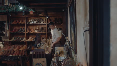 Asian Man Beginning Workday in Antique Shop