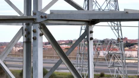 aerial close-up view of transmission tower: high-voltage power lines infrastructure