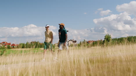 caucasian woman and african american man on the golf course.