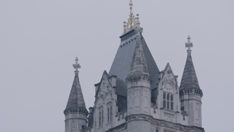 telephoto view of the famous tower bridge on a rainy day in london, tilt down