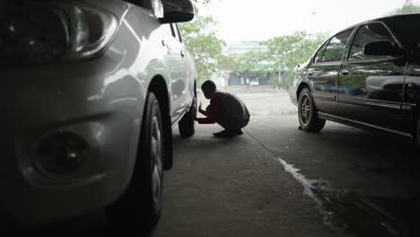 man working on a car wheel