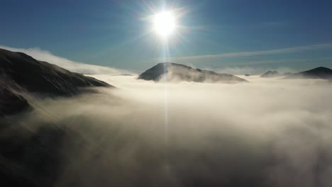 cloud inversion and sun over scottish munros, gleouraich, scotland