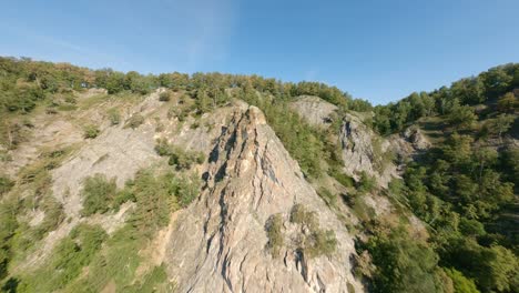 bright sunlight illuminates the majestic mountain ranges and the valley below. chain of mountains, wildlife. the concept of rock climbing, extreme recreation. panorama.