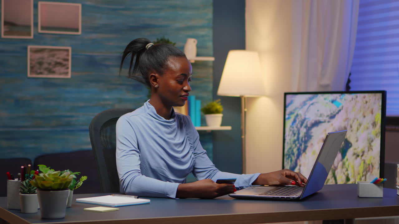 African american woman shopping online late at night