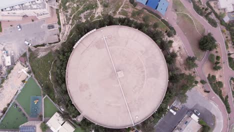 aerial view of a large water tank in a city