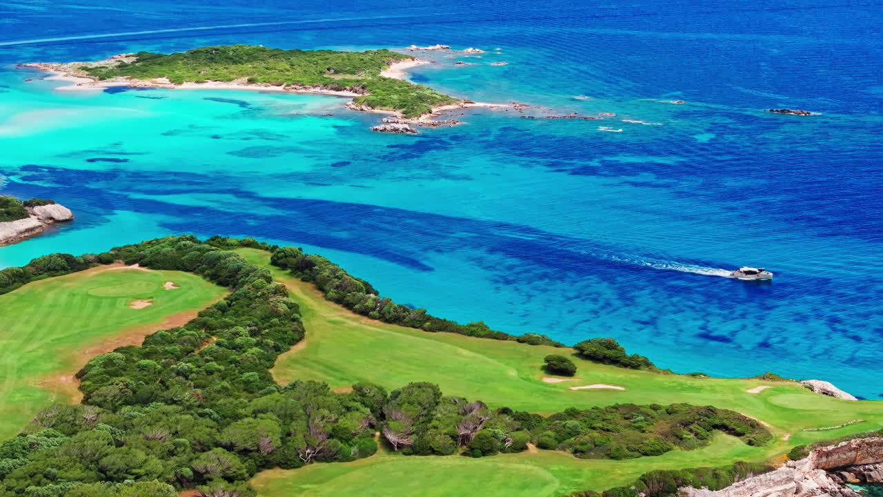Aerial drone view of beautiful coastline of Corsica, France. High view of the colorful turquoise sea and the picturesque green landscape. Bird's eye view of the beaches. Summer holidays destination