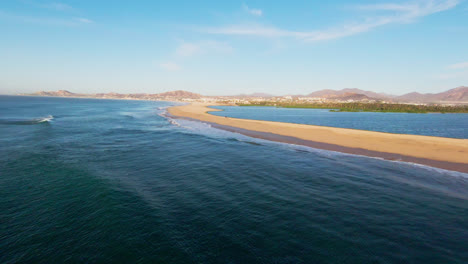 fpv drone shot of the sea of cortez with waves splashing on isla san jose in baja california sur. aerial
