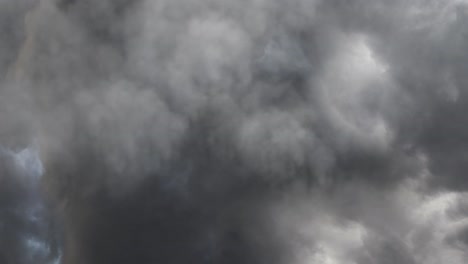 dark clouds accompanied by lightning strikes in the sky 4k