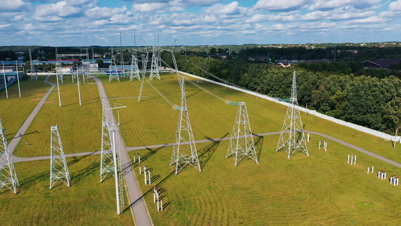 Big electric distribution industry. High voltage construction lines aerial view.