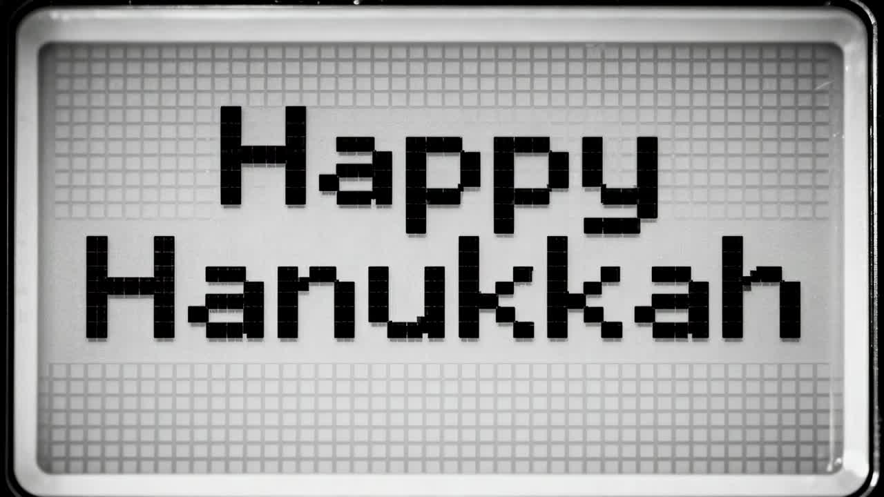 Frame advancing zooming pixel board enlarging Happy Hanukkah letters on wall revealing bezel, grid