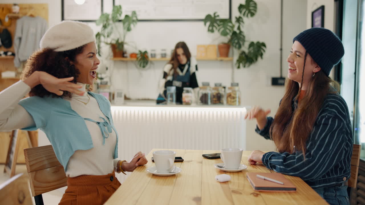 Two women in a coffee shop talking