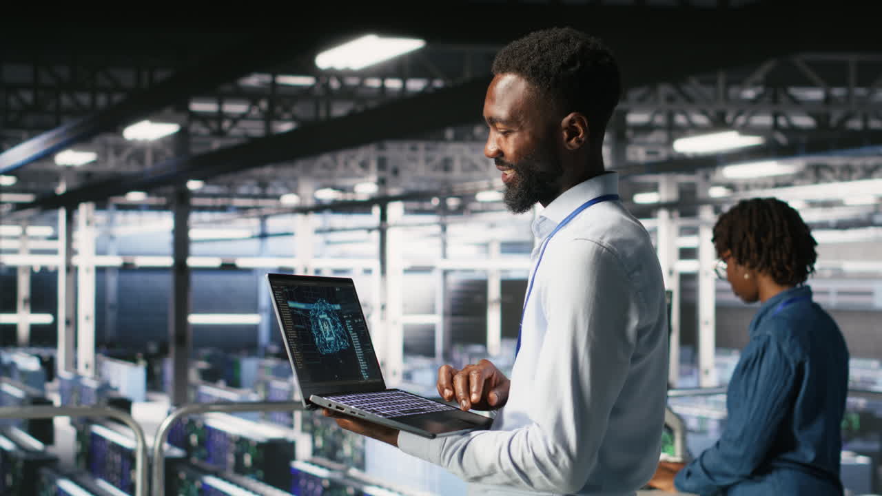 Programmer and colleague in data center reviewing AI LLM visualizations